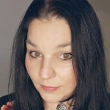 T.